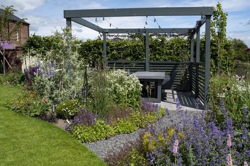 A pergola adding shelter to a seating space