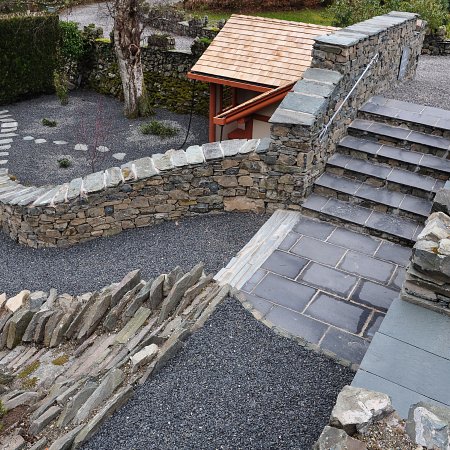 Recycled materials from site to create a garden with a Japanese feel very sympathetic to the era of the house, crevice garden, Azalea cloud planting and Japanese tea house with rain chains.
